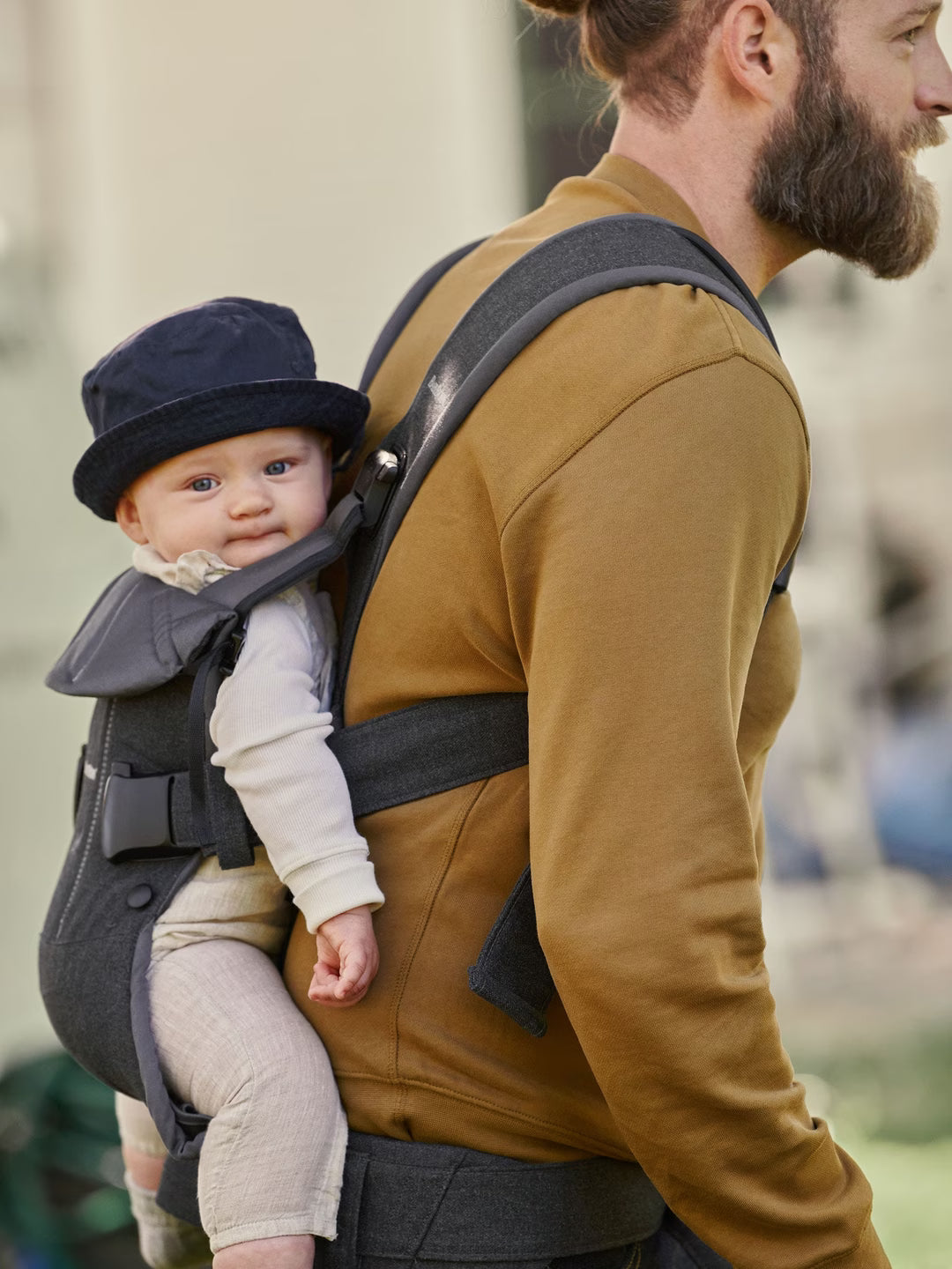 BabyBjorn One Air carrier parent wearing baby in forward-facing position