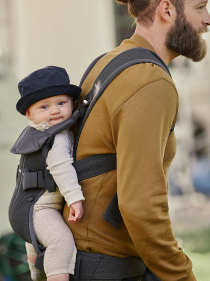 BabyBjorn One Air carrier parent wearing baby in forward-facing position